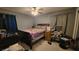 Cozy bedroom with double bed, desk, and chair at 5491 Sw 100Th Loop, Ocala, FL 34476