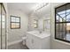 Modern bathroom with white vanity and walk-in shower at 5525 Sw 80Th Pl, Ocala, FL 34476