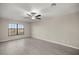 Bright bedroom featuring a large window and ceiling fan at 5525 Sw 80Th Pl, Ocala, FL 34476