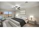 Main bedroom with large window, ceiling fan, and ample space at 5525 Sw 80Th Pl, Ocala, FL 34476