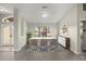 Dining area with a large window and wood-look flooring at 5525 Sw 80Th Pl, Ocala, FL 34476