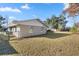 House with a spacious backyard and chain link fence at 562 Silver Course Loop, Ocala, FL 34472