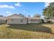 Single story home with a sunroom and large backyard at 562 Silver Course Loop, Ocala, FL 34472