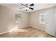 Bedroom with ceiling fan and two windows at 562 Silver Course Loop, Ocala, FL 34472