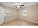 Well-lit bedroom with ceiling fan and window blinds at 562 Silver Course Loop, Ocala, FL 34472