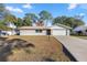 Ranch style home with a large yard and driveway at 562 Silver Course Loop, Ocala, FL 34472