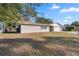 Ranch style home with a large front yard and attached garage at 562 Silver Course Loop, Ocala, FL 34472