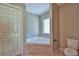 Bathroom with corner tub, double sinks and separate shower at 6170 Nw 61 Ln, Ocala, FL 34482