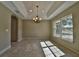 Bright dining room with tile floors and chandelier at 6363 Nw 61 Ave, Ocala, FL 34482