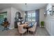 Elegant dining room featuring a wood table and neutral decor at 6758 Sw 94Th Cir, Ocala, FL 34481