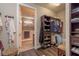 Spacious walk-in closet, custom shelving and hanging space at 6758 Sw 94Th Cir, Ocala, FL 34481