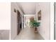 A long hallway with tile flooring and potted plant at 7 Bahia Circle Loop, Ocala, FL 34472