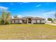 One-story house with a front yard and dark-colored exterior at 7 Bahia Circle Loop, Ocala, FL 34472