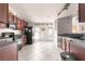 Kitchen features dark wood cabinets and modern appliances at 7 Bahia Circle Loop, Ocala, FL 34472