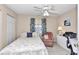 Bright bedroom with a bed, armchair, and workspace at 8137 Sw 117Th Loop, Ocala, FL 34481