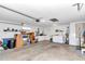 Bright garage with washer, dryer, and ample storage shelving at 8137 Sw 117Th Loop, Ocala, FL 34481