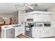 White kitchen with stainless steel appliances and ample counter space at 8137 Sw 117Th Loop, Ocala, FL 34481