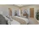 Main bedroom with ensuite bathroom and walk-in closet at 8562 Pinecrest Trl, Wildwood, FL 34785