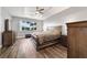 Main bedroom with wood floors and large windows at 9010 Sw 89Th Loop, Ocala, FL 34481