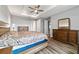 Main bedroom with wood floors, and large dresser at 9010 Sw 89Th Loop, Ocala, FL 34481