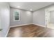 Bright bedroom featuring hardwood floors and neutral wall colors at 9010 Sw 89Th Loop, Ocala, FL 34481