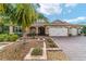 Single-story house, three-car garage, attractive landscaping at 9010 Sw 89Th Loop, Ocala, FL 34481