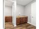 Laundry room with wood cabinets and granite countertops at 9010 Sw 89Th Loop, Ocala, FL 34481