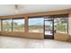 Relaxing screened porch with tile floor and backyard view at 9010 Sw 89Th Loop, Ocala, FL 34481