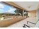 Spacious screened porch with tiled floor, ceiling fan, and ample natural light at 9010 Sw 89Th Loop, Ocala, FL 34481