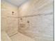 Walk-in shower with tiled walls and built-in seat at 9010 Sw 89Th Loop, Ocala, FL 34481