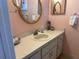 Bathroom with a vanity, sink, and mirror at 11490 Sw 85Th Ave, Ocala, FL 34481