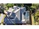 Aerial view of a house with tile roof, pool, and large backyard at 1219 Se 46Th St, Ocala, FL 34480