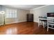 Dining area with hardwood floors and a corner display cabinet at 1219 Se 46Th St, Ocala, FL 34480