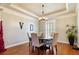 Elegant dining room with wood floors and a charming round table set at 1219 Se 46Th St, Ocala, FL 34480