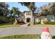 Two-story house with a paver driveway and Christmas decorations at 1219 Se 46Th St, Ocala, FL 34480