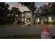 Two-story house with lighting and Christmas decorations in the front yard at 1219 Se 46Th St, Ocala, FL 34480