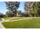 Two-story house with circular driveway and lush landscaping at 1219 Se 46Th St, Ocala, FL 34480