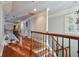 Upstairs hallway with hardwood floors and high ceilings at 1219 Se 46Th St, Ocala, FL 34480