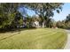 Two-story house with landscaped yard and circular driveway at 1219 Se 46Th St, Ocala, FL 34480