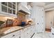 Bright kitchen with granite counters and white cabinetry at 1219 Se 46Th St, Ocala, FL 34480