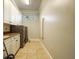 Laundry room with washer, dryer, cabinets, and countertop at 1219 Se 46Th St, Ocala, FL 34480