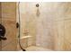 Walk-in shower with beige tile and built-in seat at 1219 Se 46Th St, Ocala, FL 34480