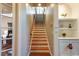 Elegant wooden staircase with built-in shelving at 1219 Se 46Th St, Ocala, FL 34480