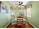 Bright breakfast nook with wood floors and window seat at 12498 Se 92Nd Ave, Summerfield, FL 34491