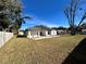 House with grassy backyard and white fence at 1846 Ne 127Th Pl, Anthony, FL 32617