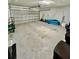 Two-car garage with light-grey flooring at 1846 Ne 127Th Pl, Anthony, FL 32617