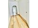 Bright hallway with light flooring and an arch mirror at 1846 Ne 127Th Pl, Anthony, FL 32617