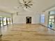 Open and airy living room featuring light wood floors and high ceilings at 1846 Ne 127Th Pl, Anthony, FL 32617