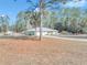 Single-story home with a large yard and trees at 20189 Sw 77Th St, Dunnellon, FL 34431