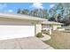 White garage door and walkway at 20189 Sw 77Th St, Dunnellon, FL 34431